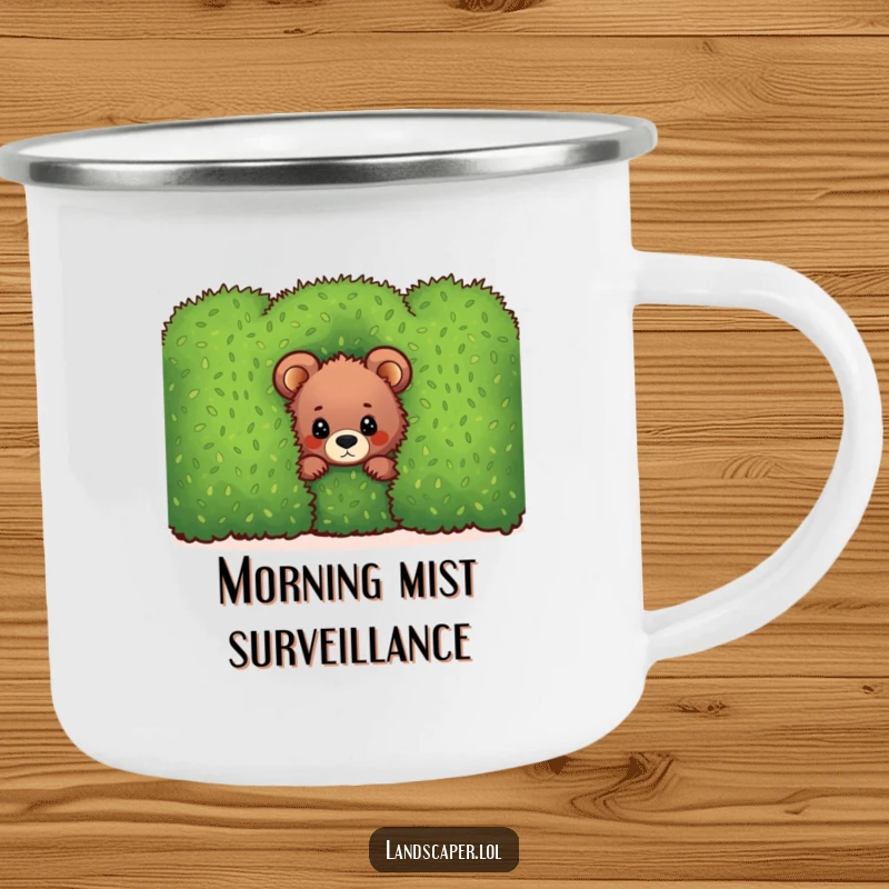 Funny bear cub camping mug, peeking from behind a green hedge, great for outdoor coffee or tea with a humorous touch.