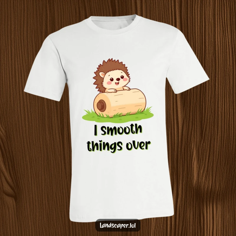Funny t-shirt featuring a happy hedgehog rolling a big green lawn roller across grass, symbolizing hard work and cuteness.